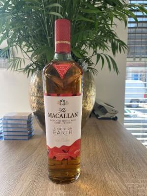 Photo of whisky bottle in cluttered surroundings